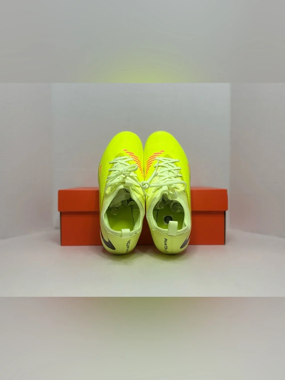 Nike Neon Yellow Soccer Cleats with Orange and Black Accents